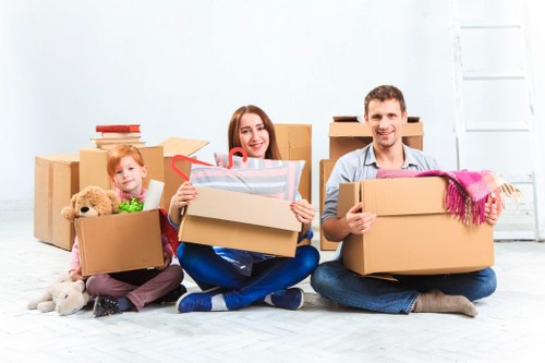 Office relocation planning in Queens Park with packed boxes and workstations