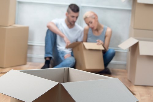 Careful loading of household furniture for transport in Queens Park