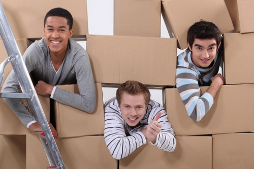 Careful loading of household items for a Queens Park apartment removal