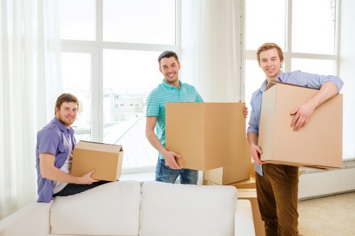 Furniture and boxes being loaded for a Queens Park home relocation