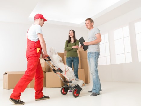 Packing and labelling office equipment for a business move in Queens Park