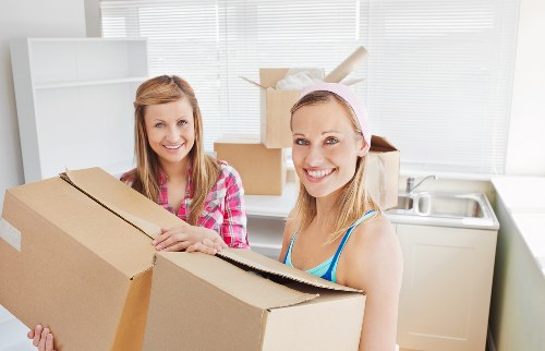 Furniture and personal items being handled during a local student removal