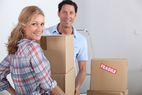 Preparing items for collection by a moving truck in Queens Park