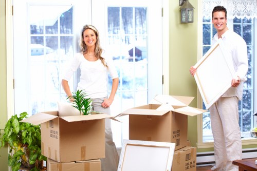 Packed boxes and commercial contents ready for transport from a Queens Park premises
